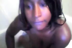 Extremely hot and charming ebon hottie dildoing herself in the bath