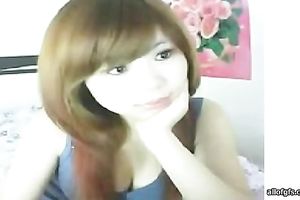 Delightful and delicate Asian redhead honey on web camera