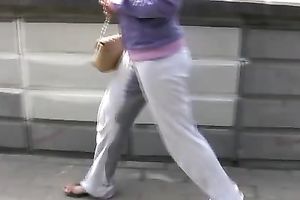 Irina pees her pants and changes her garments in a park