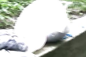 Irina pees her pants and changes her garments in a park