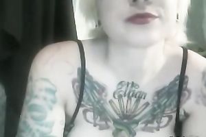 Heavily tattooed golden-haired with large breasts finger bangs her cum-hole
