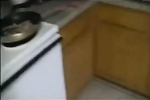 Sexy swarthy white bitch cooking breakfast in her satin pants