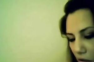 This dark brown vixen is proudly flashing her large white bra buddies