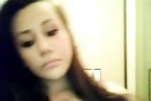 This dark brown vixen is proudly flashing her large white bra buddies