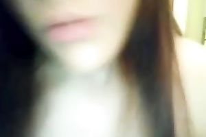 This dark brown vixen is proudly flashing her large white bra buddies