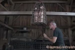 Poor serf girl livi9ng in an cage receives her cookie and butt toyed