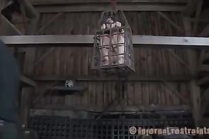 Poor serf girl livi9ng in an cage receives her cookie and butt toyed