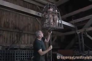 Poor serf girl livi9ng in an cage receives her cookie and butt toyed