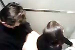 Spied on a slutty pair in the public WC fucking