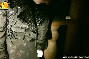 Depraved golden-haired floozy piddles on a cold night outdoors