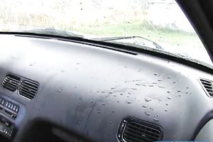 Stunning blond with large wobblers is masturbating in her car