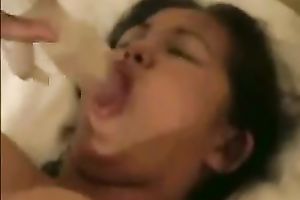 Asian hussy fingers her bald twat and sucks a sex-toy