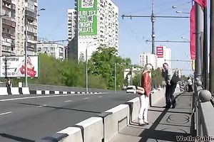 Depraved blond Irina pees her pants in a public place