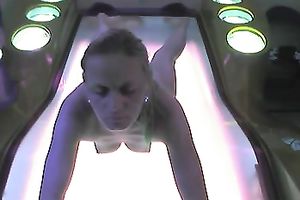 Fuckable golden-haired slut was caught on hidden webcam in solarium