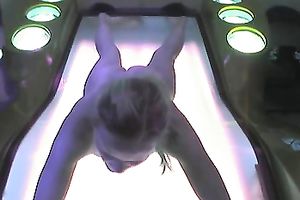 Fuckable golden-haired slut was caught on hidden webcam in solarium