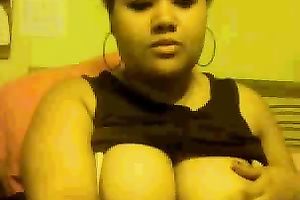 Chubby mulatto playgirl sucks her fingers and fondles her big tits