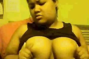 Chubby mulatto playgirl sucks her fingers and fondles her big tits