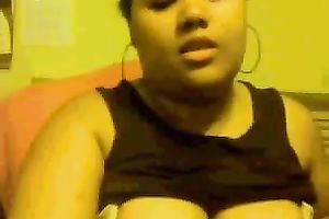 Chubby mulatto playgirl sucks her fingers and fondles her big tits