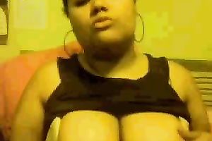 Chubby mulatto playgirl sucks her fingers and fondles her big tits