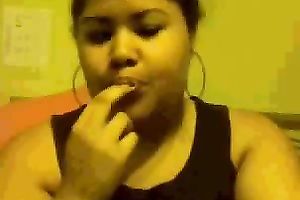 Chubby mulatto playgirl sucks her fingers and fondles her big tits