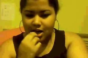 Chubby mulatto playgirl sucks her fingers and fondles her big tits