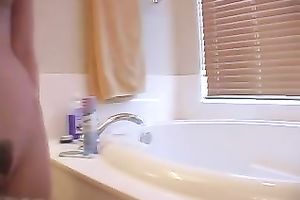 Petite pink skin legal age teenager shaves her legs in the bath