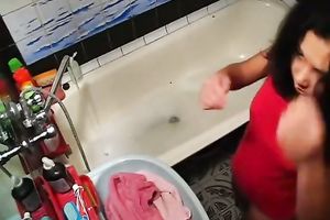 Tanned playgirl with diminutive milk shakes is masturbating in the bathtub