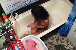 Tanned playgirl with diminutive milk shakes is masturbating in the bathtub