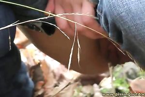 Brunette honey was walking outdoors and decided to pee