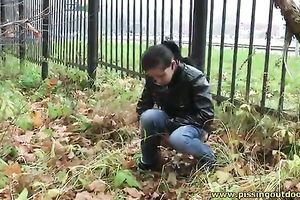 Brunette honey was walking outdoors and decided to pee