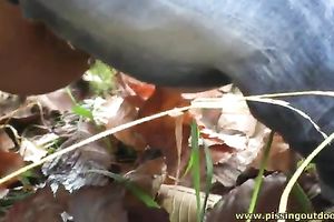 Brunette honey was walking outdoors and decided to pee