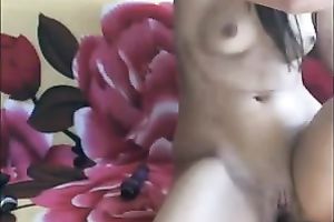 Hot slender brunette hair rubs her bald vagina on web camera