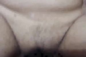 Flamboyant brunette hair wench receives her unshaved muff nailed hard in missionary style