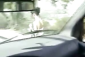 Curly-haired bitch gives her guy a worthwhile oral-service in his car