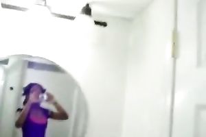 My cute ebon girlfriend in white pants tapes herself in bath