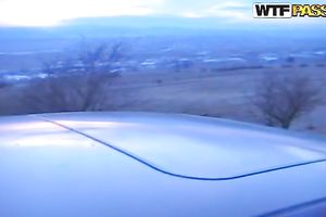 Busty dark brown in the car having oral sex with her boyfriend