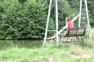 Lewd non-professional gal climbs a fence to void urine down on the ground