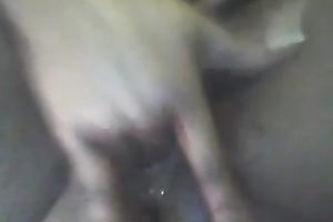 Dirty and concupiscent dark girlfriend playing with her vagina in closeup movie scene