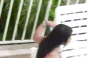 Teen brunette hair latin chick honey on the lounger by the pool