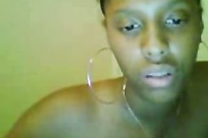 Petite swarthy chick rubs her bald constricted fur pie on the web camera