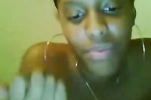 Petite swarthy chick rubs her bald constricted fur pie on the web camera