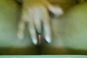 Petite swarthy chick rubs her bald constricted fur pie on the web camera