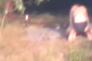 Peeking on one non-professional pair having enjoyment on the lake shore