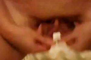 Hot babe stretches her big cookie lips in front of a camera