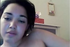 Cute pale skin juvenile brunette hair gently touches herself