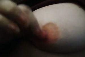 Mature neighbor playing with large firm teats intensively