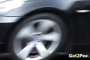 Nice shaped dilettante dark brown is just pissing on the parking lot