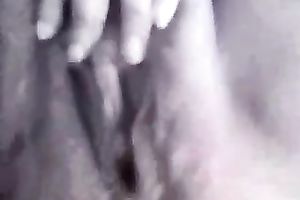 Mature woman fingering hirsute cookie in amateur movie