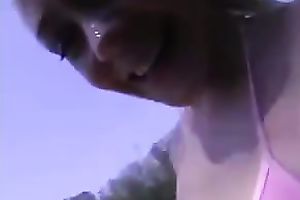 Spoiled playgirl masturbating in the nature below the open sky