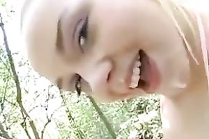 Spoiled playgirl masturbating in the nature below the open sky